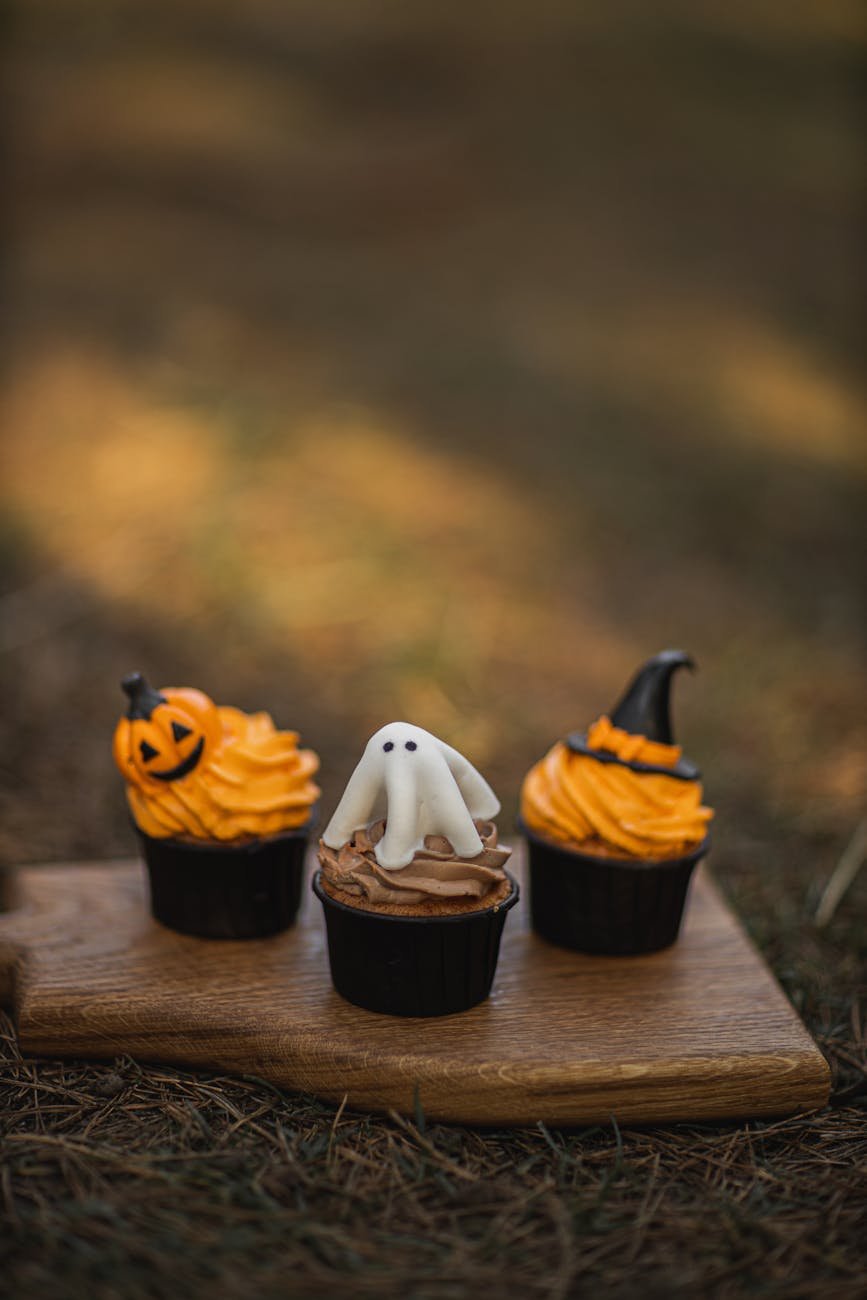 halloween cupcakes on wooden board